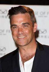 Escucha la canción de Robbie Williams She's The One gratis de lista de reproducción de Canciones de amor en línea.
