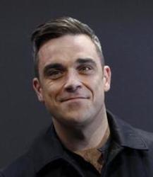 Además de la música de Rio De Janeiro Ensemble, te recomendamos que escuches canciones de Robbie Williams gratis.